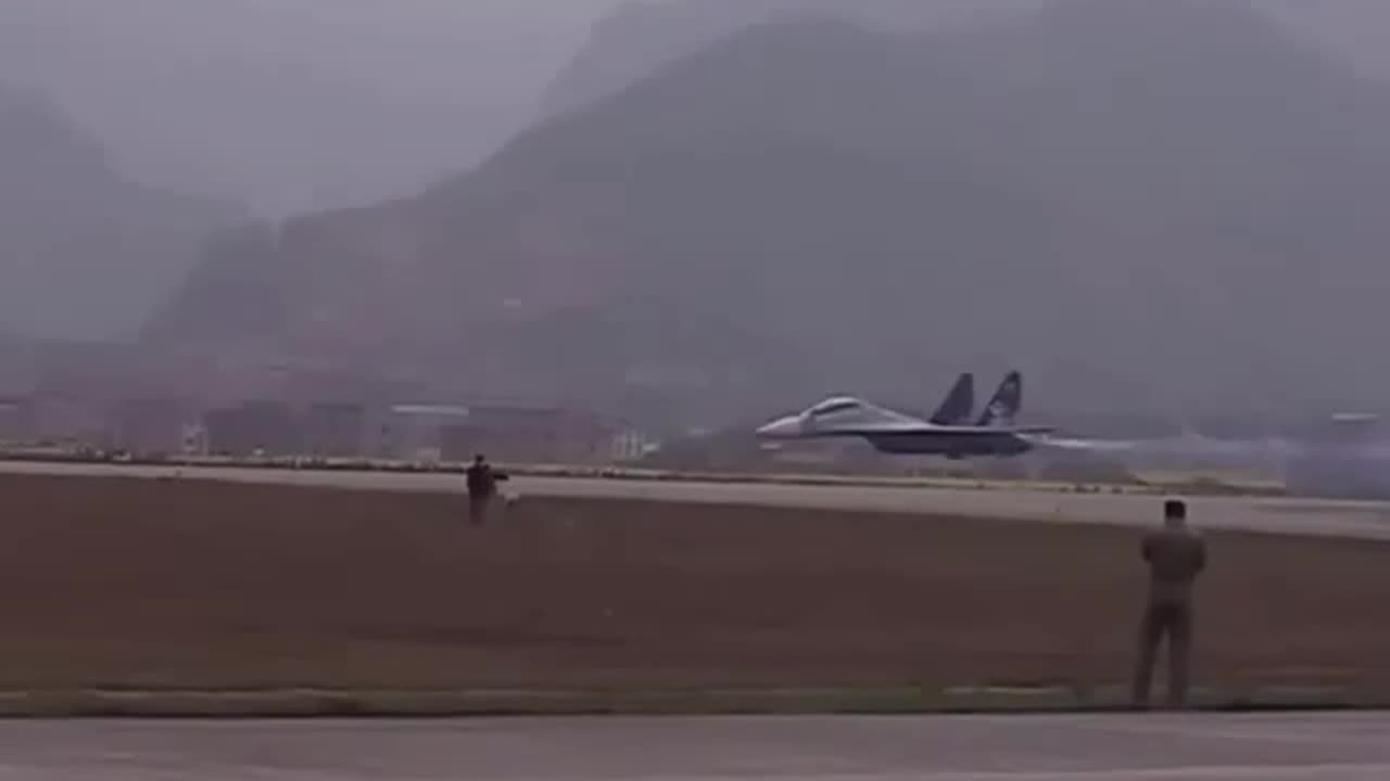 Su-30 performing low fly above runway
