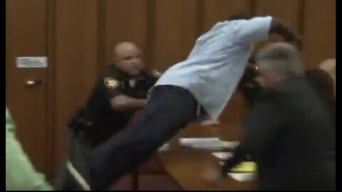 Dad Jumps Over Table To Attack Daughter's Killer in Court