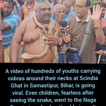 Hundreds of people with snakes around their necks..