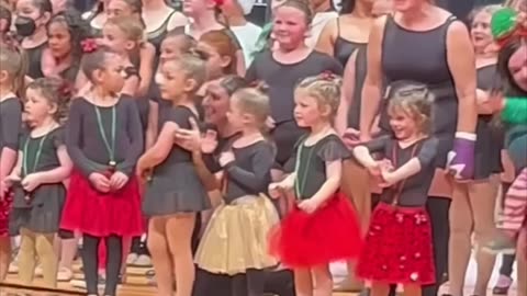 Little girl looks for her family in the crowd