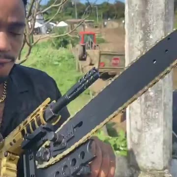 Quavo put a chainsaw attachment on his new gold assault rifle 😳