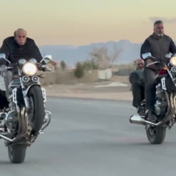 Old Iranian man's unicycle with a motor