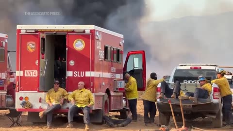 Massive wildfire in central California threatens homes, injures 3 people