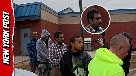 Aqeel Ahmad, fourth from the back with mustache, is walked out of the Suffolk County 6th precinct on Oct. 29.