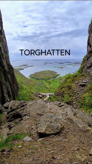 Hiking up Torghatten on a windy day.