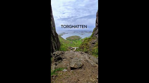 Hiking up Torghatten on a windy day.