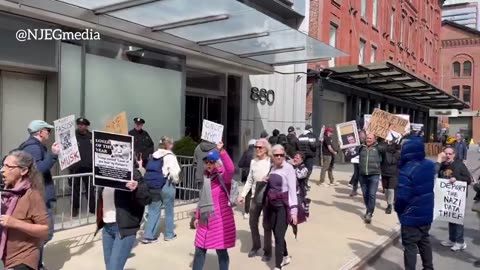 Protesters in NYC chant "Shut down DOGE" outside a Tesla showroom in NYC