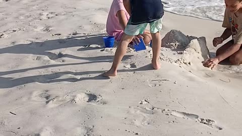 Playing in sand Thanksgiving 2024