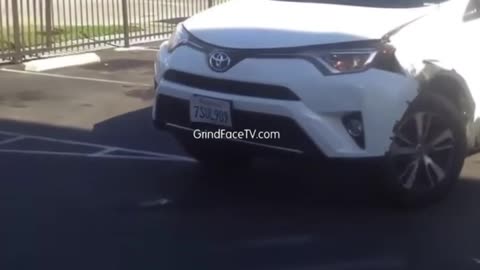 Women playing real life bumper cars in the laundromat parking lot