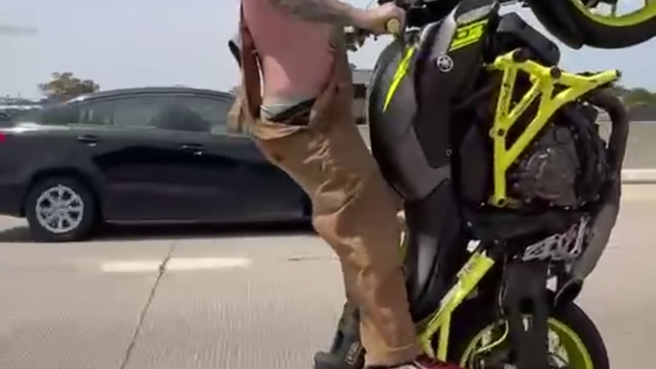 Stunt Rider Crashes Bike on Highway