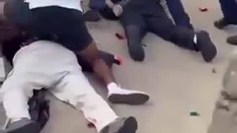 Aussie bystander is seen kicking one of the suspects in the head at Bondi Beach