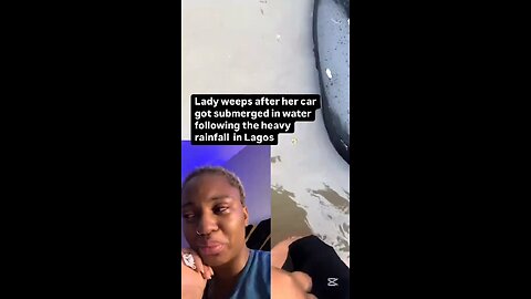Woman in tears after her car was submerged in water following rainfall in Nigeria