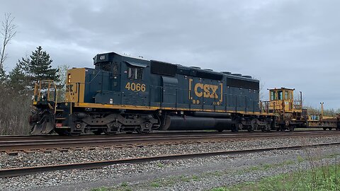 CSX train moving rails on the rails