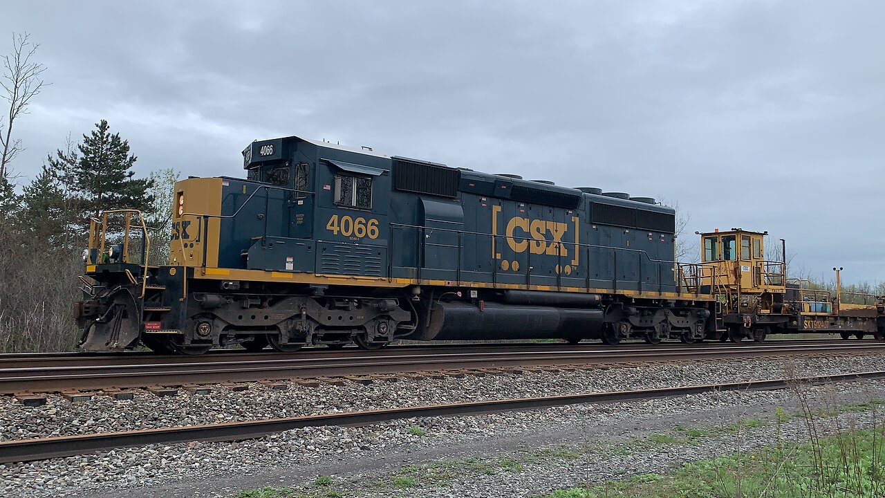CSX train moving rails on the rails
