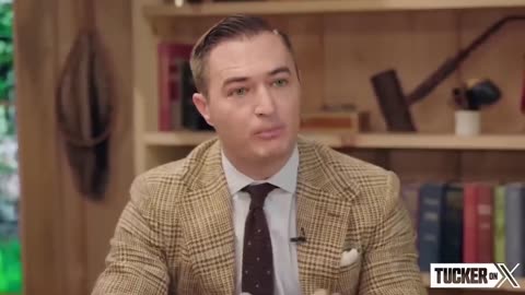 Watch Tucker Carlsons Face When Hes Told the Cause of the Trans Boom