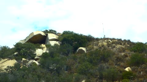 Boulders upon a hill overlooking the traffic