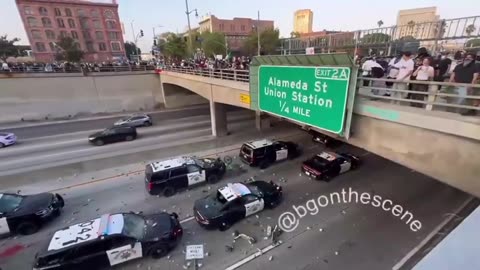 California rioters throws rocks at police driving on the highway
