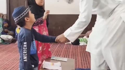 Islamic education with stick. Poor children.