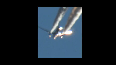 Man with a Nikon p1000 camera zoomed in on a chemtrail plane