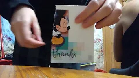 Ripping a Mickey Mouse card up