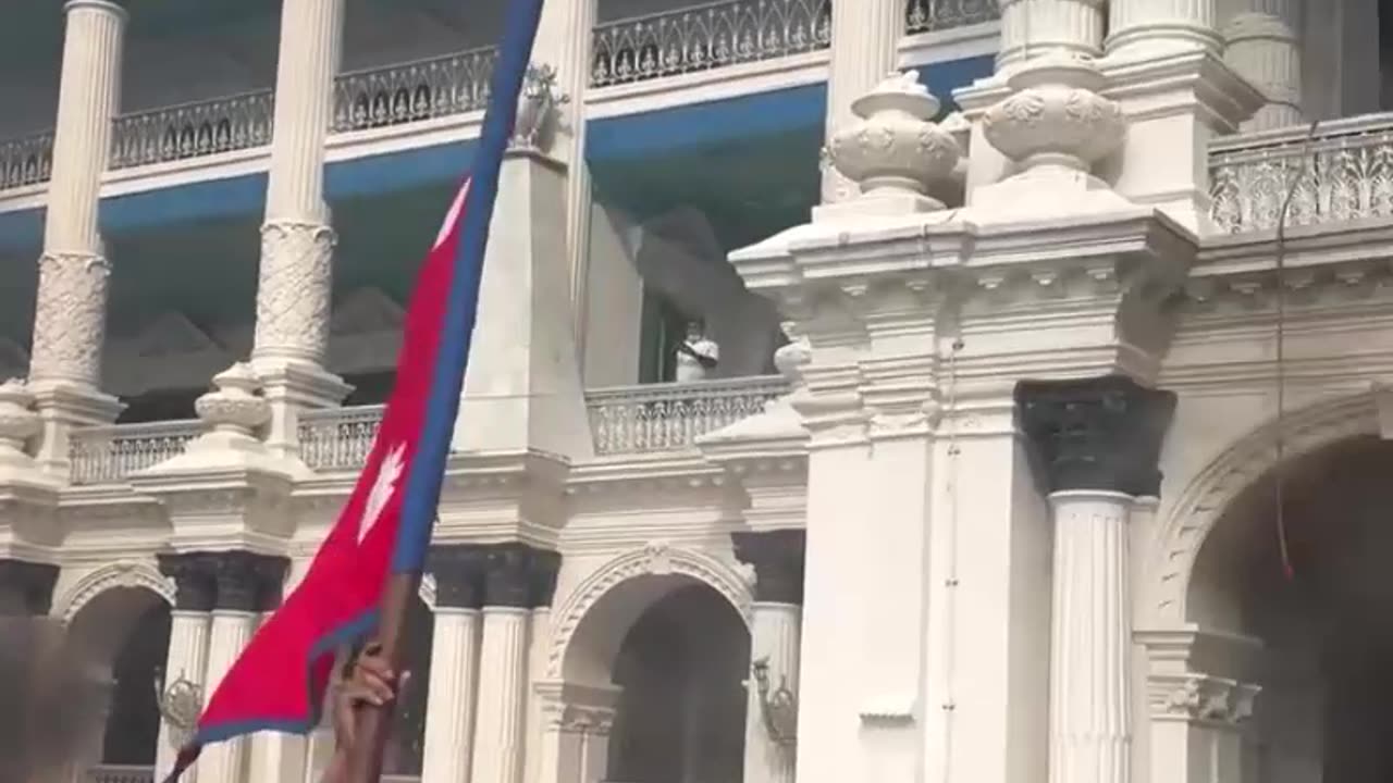Nepalese protesters rejoicing in front of the burning Parliament. @PressTV