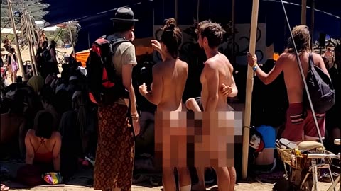 Hot nudist couple at festival