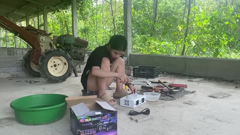 girl repairing the heating lamp in the house