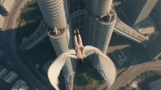 Guy trying Wright Brothers Wings from Petronas Towers