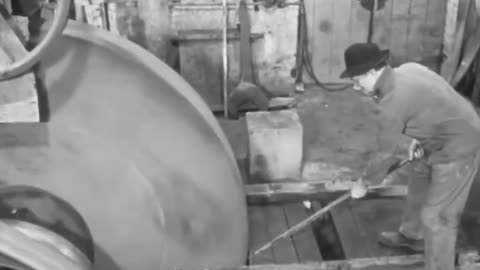 Workers change out the stone in a grind seat