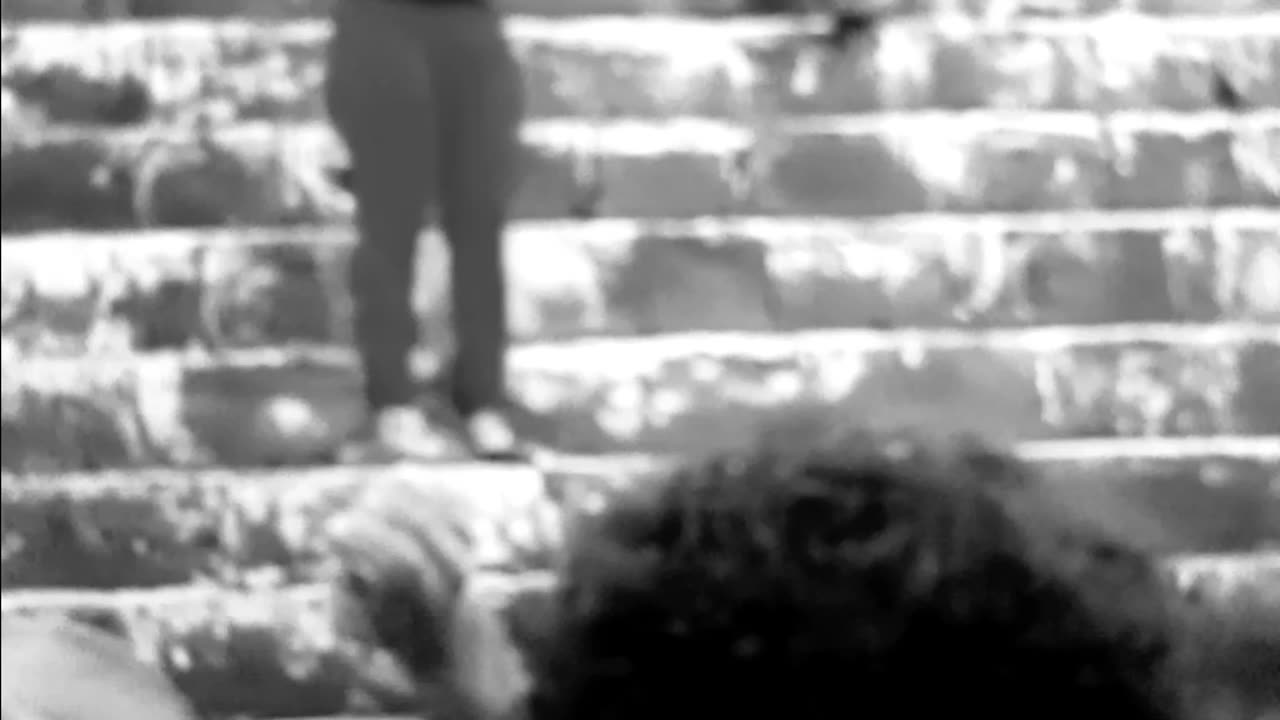 Idiot that climbed ancient Mayan pyramid, gets water tossed on her