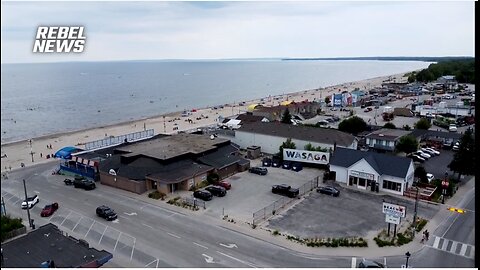 Canadian East Indian Defecates on Wasaga Beach Ontario