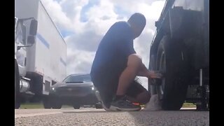 Man records himself changing tire on side of road, causes accident