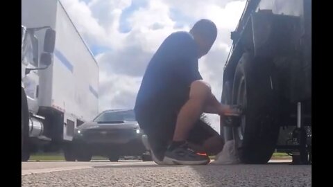Man records himself changing tire on side of road, causes accident