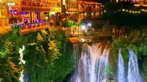 Riverside Charm: Lights and Water in [Possible Location] 🏮🏞️