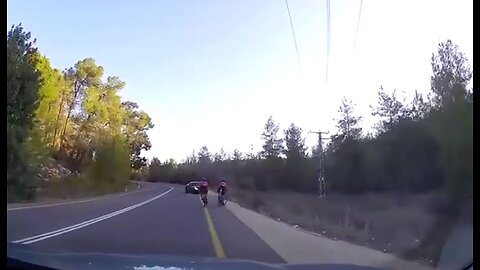Oncoming car loses control, heads straight for 2 bicyclists, dashcam