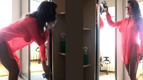 Transparent cleaning mirror with model girl in a dress