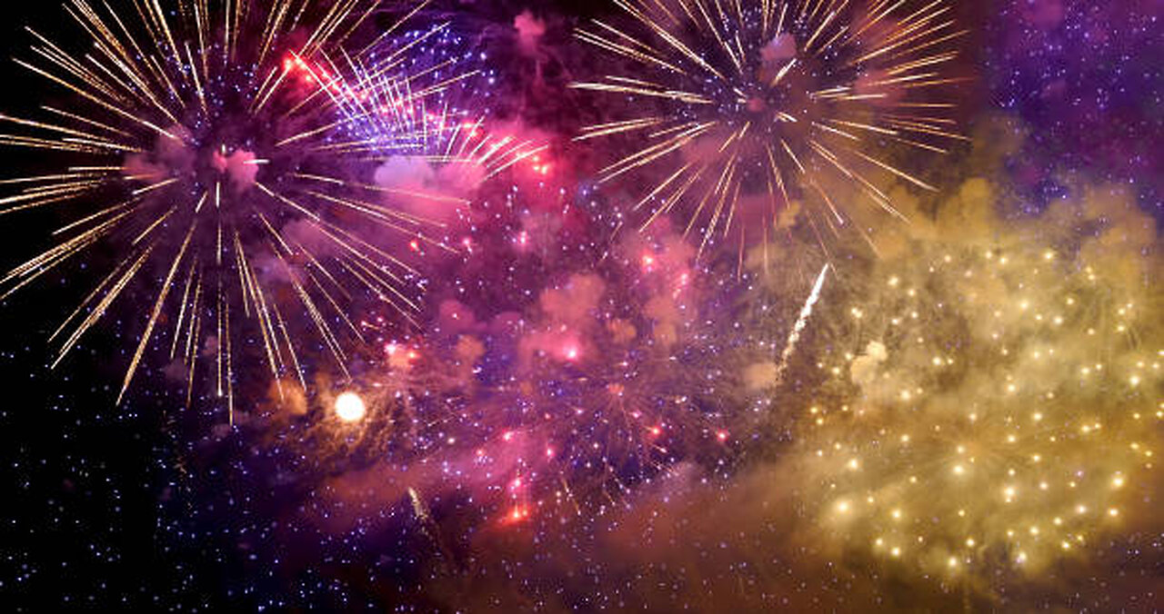 Fireworks illuminating the beach sky.
