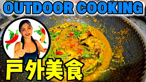Asian Girl Coking Curry Fish