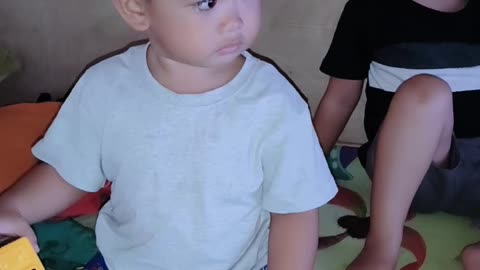 Baby Isaiah and Grey watching TV together