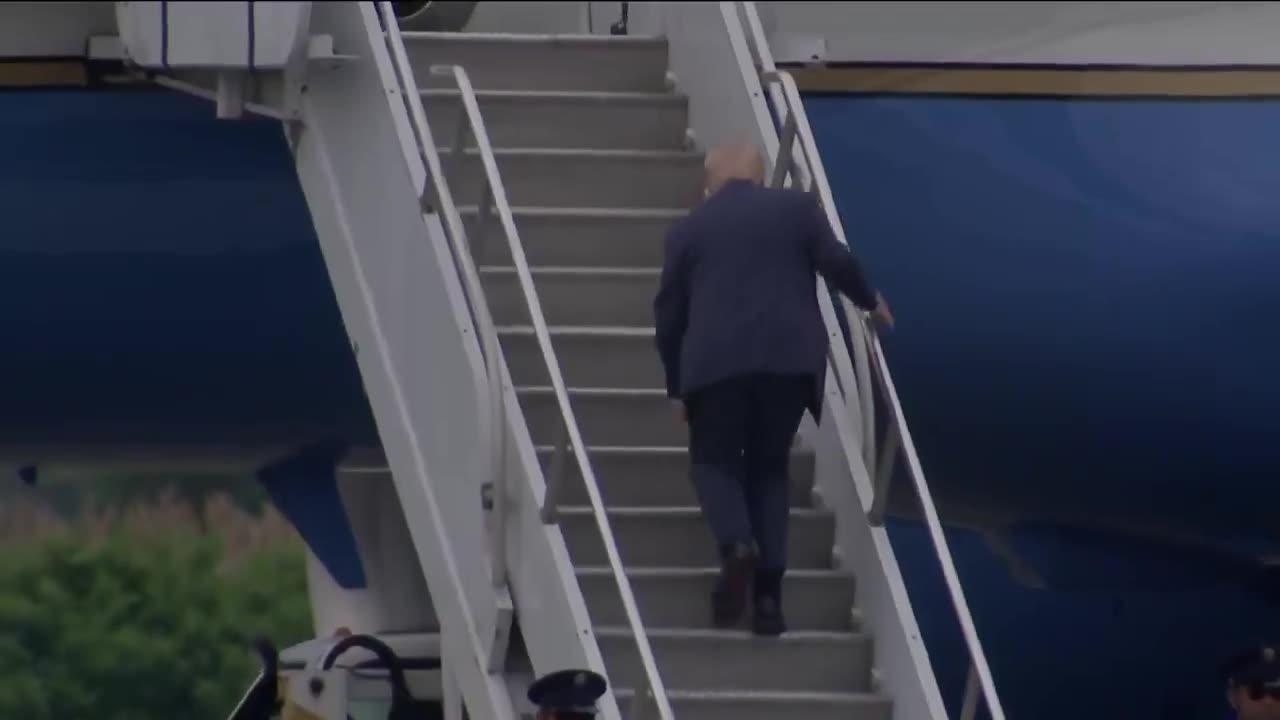 President Trump stumbles and nearly falls while climbing the stairs of Air Force One...