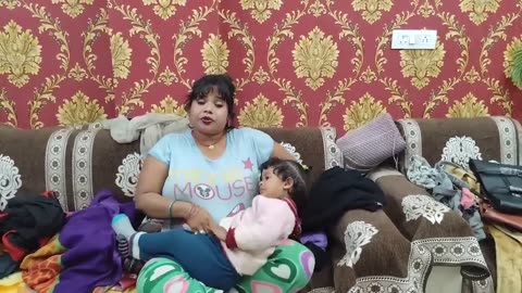 Feeding The Baby in Front of Camera