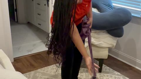 Dog Plays Tug of War With Woman's Hair