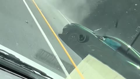 Ford Mustang Mach-E seen scraping against a highway wall before slamming into another car