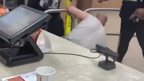 Cashier fights customer