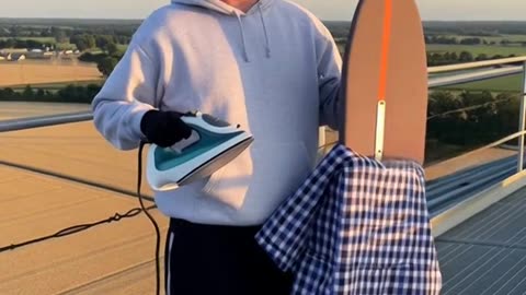 LEVI EXTREME IRONING ON TOP OF A GRAIN ELEVATOR