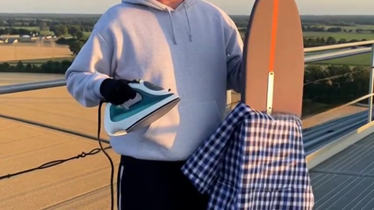 LEVI EXTREME IRONING ON TOP OF A GRAIN ELEVATOR