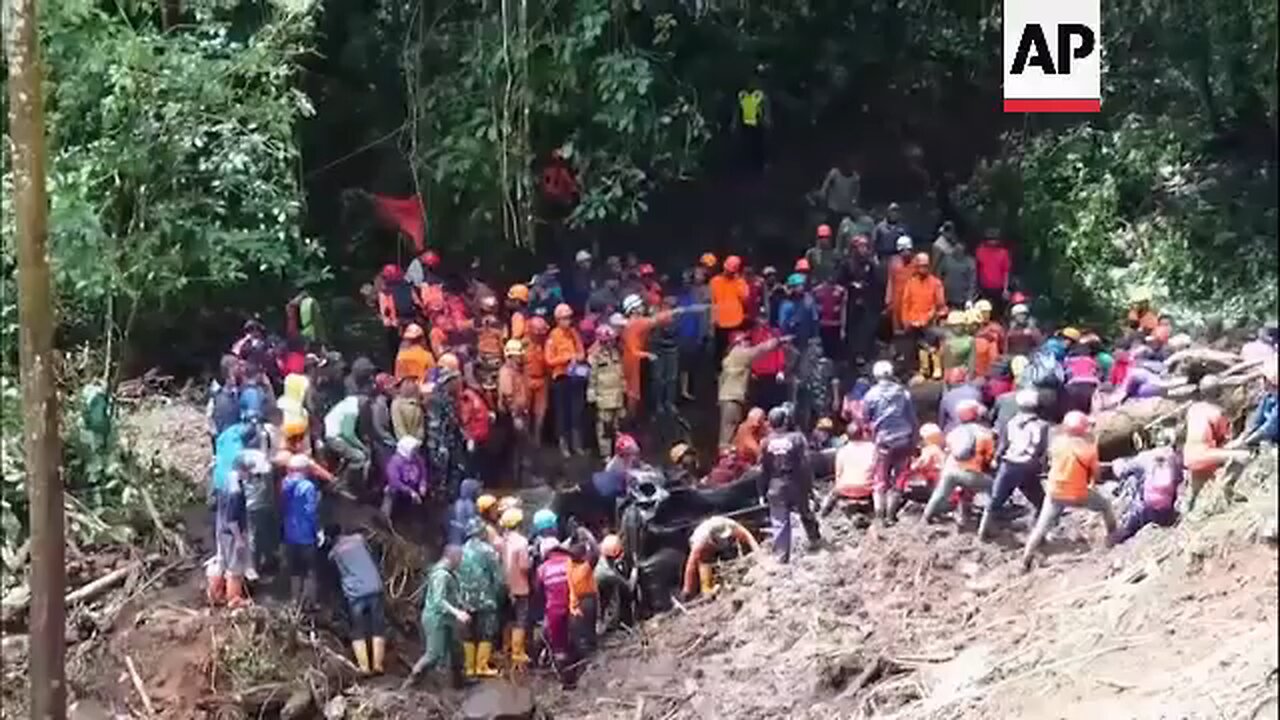Search efforts continue on Indonesia's Java with at least 10 dead as landslide hits passing cars