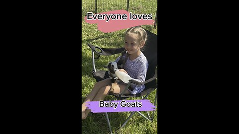 Bottle feeding cute baby goats, what could be better?