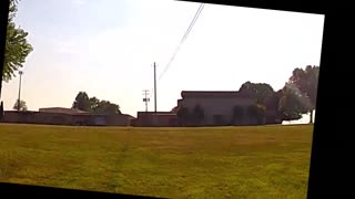 EvanCoons: "Crooks" Head Pops Up Into View from Podium @18:04:40.15 after Crossing Gap to Lower Bldg