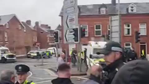 Hundreds of people have turned up on a grey and wet evening to stand with the
